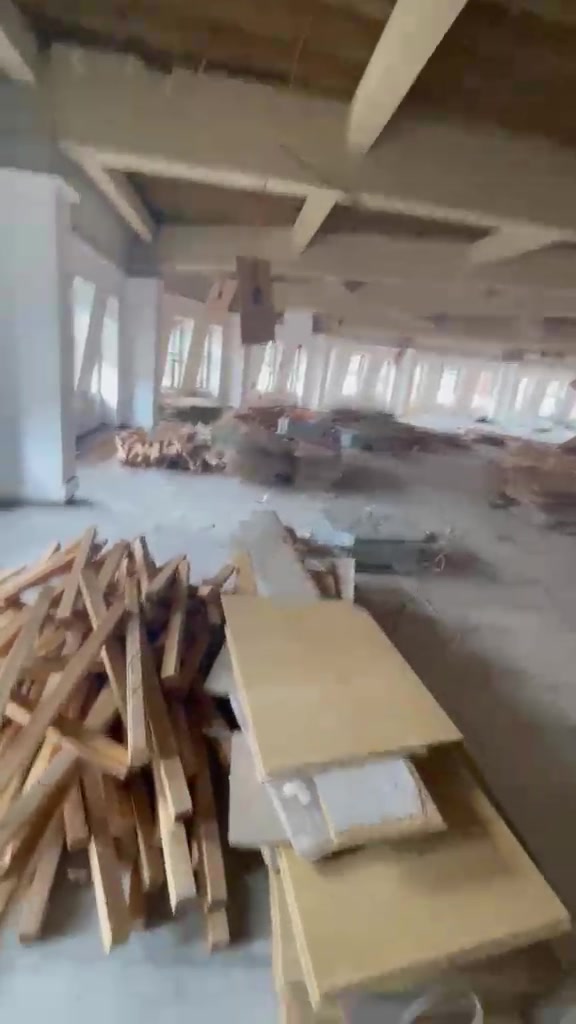 Timber and other removed fit-out materials grouped inside Halifax House during the works.