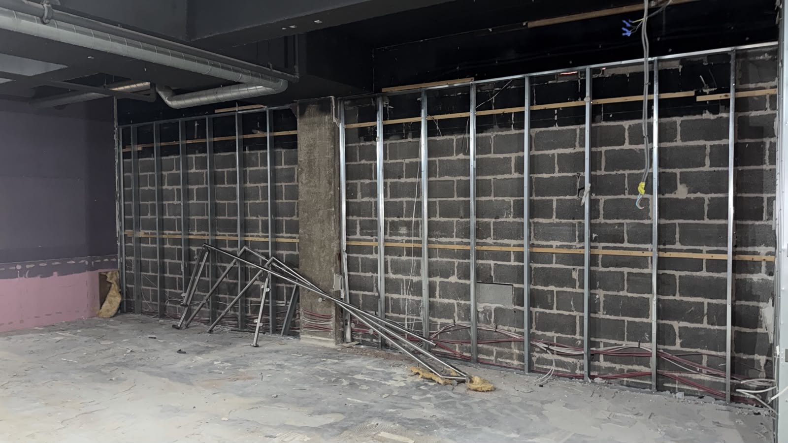 Exposed masonry and metal wall framing during the internal strip-out at 28 Market Street.